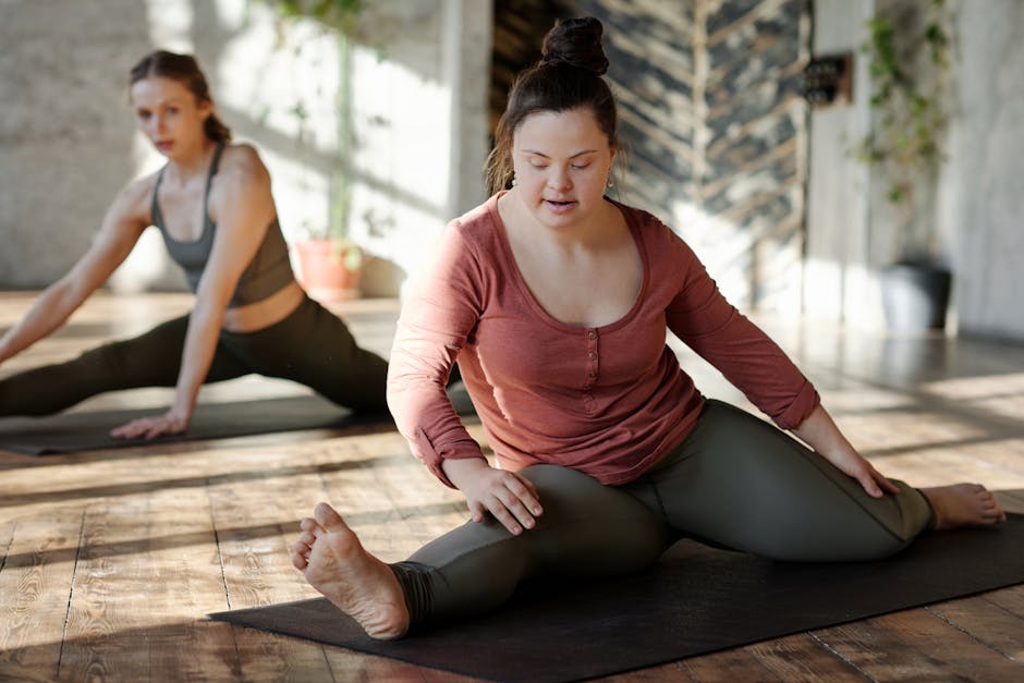Woman performing a gentle yoga stretch in a sunlit room.
